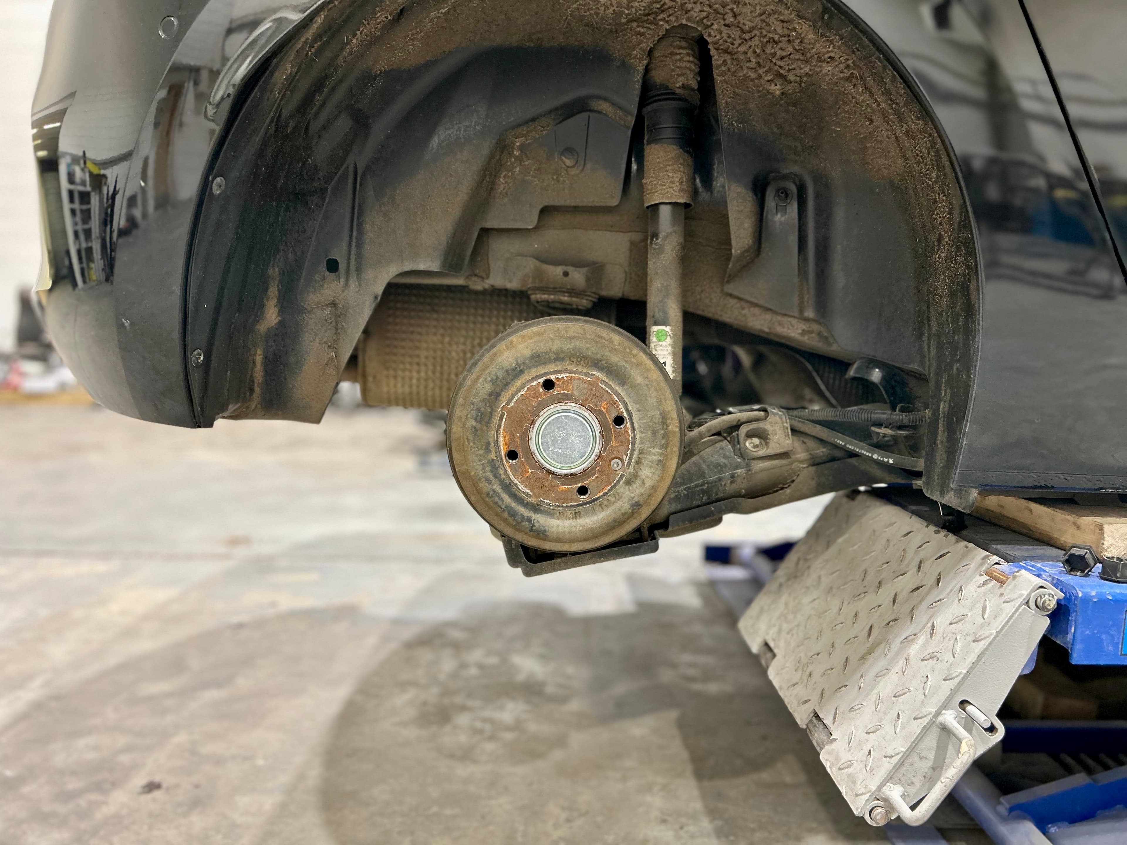 Routine vehicle servicing including brakes and wheel removal