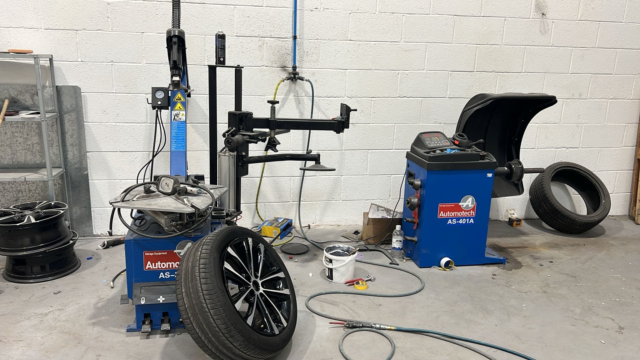 Tyre fitting and wheel balancing using specialist workshop equipment